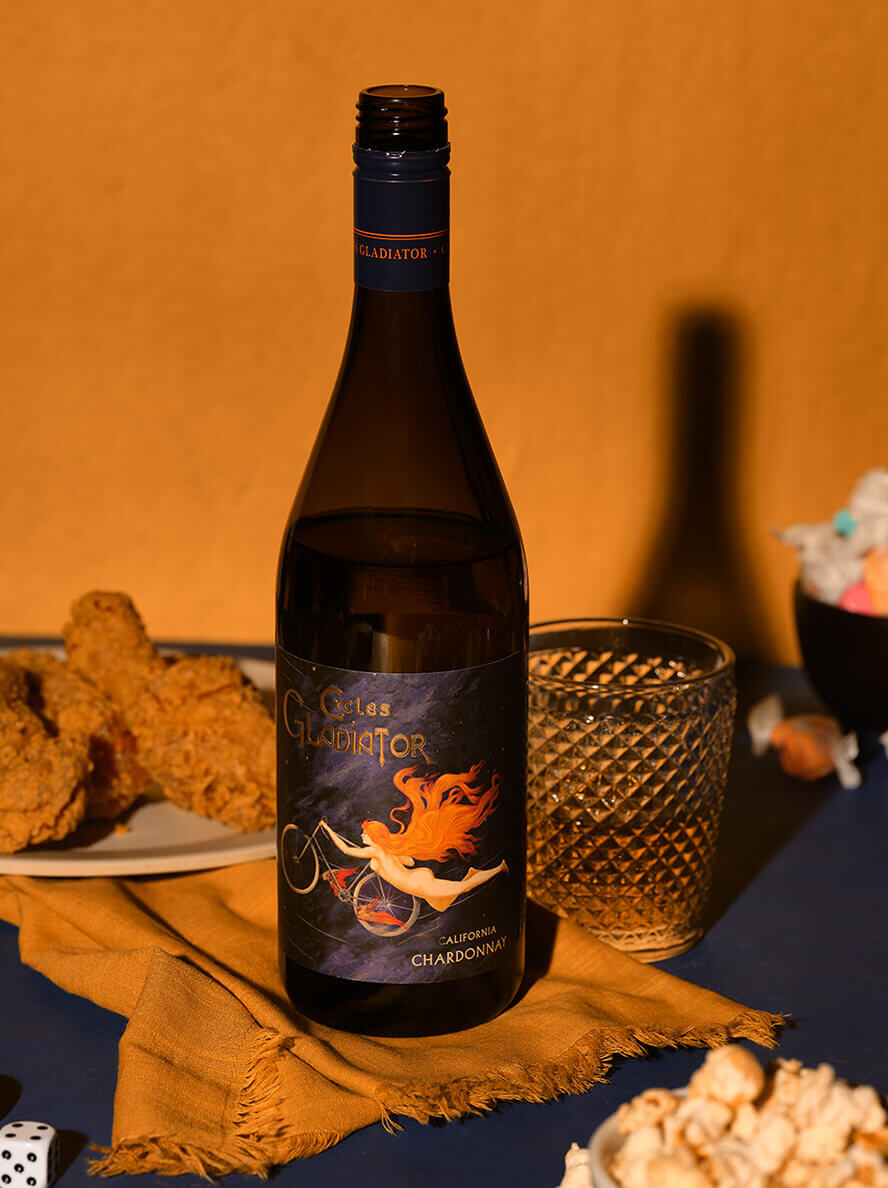 Chardonnay Cycles bottle with chicken wings and glass thumbnail